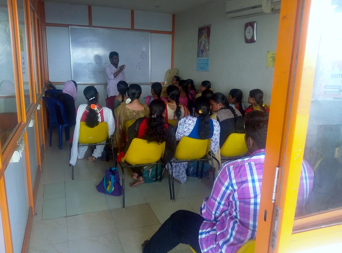 A trainer teaching a class at Milton English and Hindi Academy