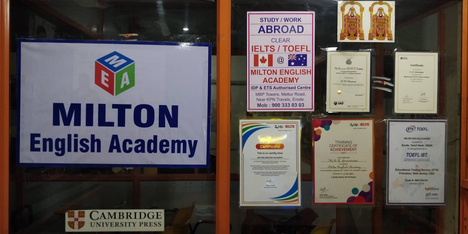 The academy's storefront with its IELTS and TOEFL poster and framed certificates
