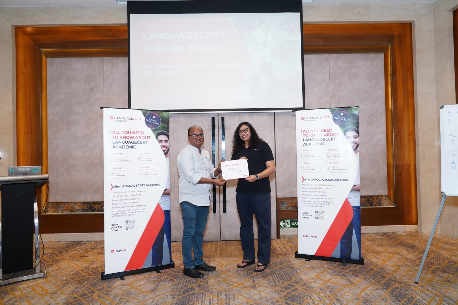 A certificate being presented at a LanguageCert Train the Trainer session